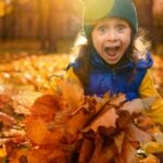 girl in the fall leaves