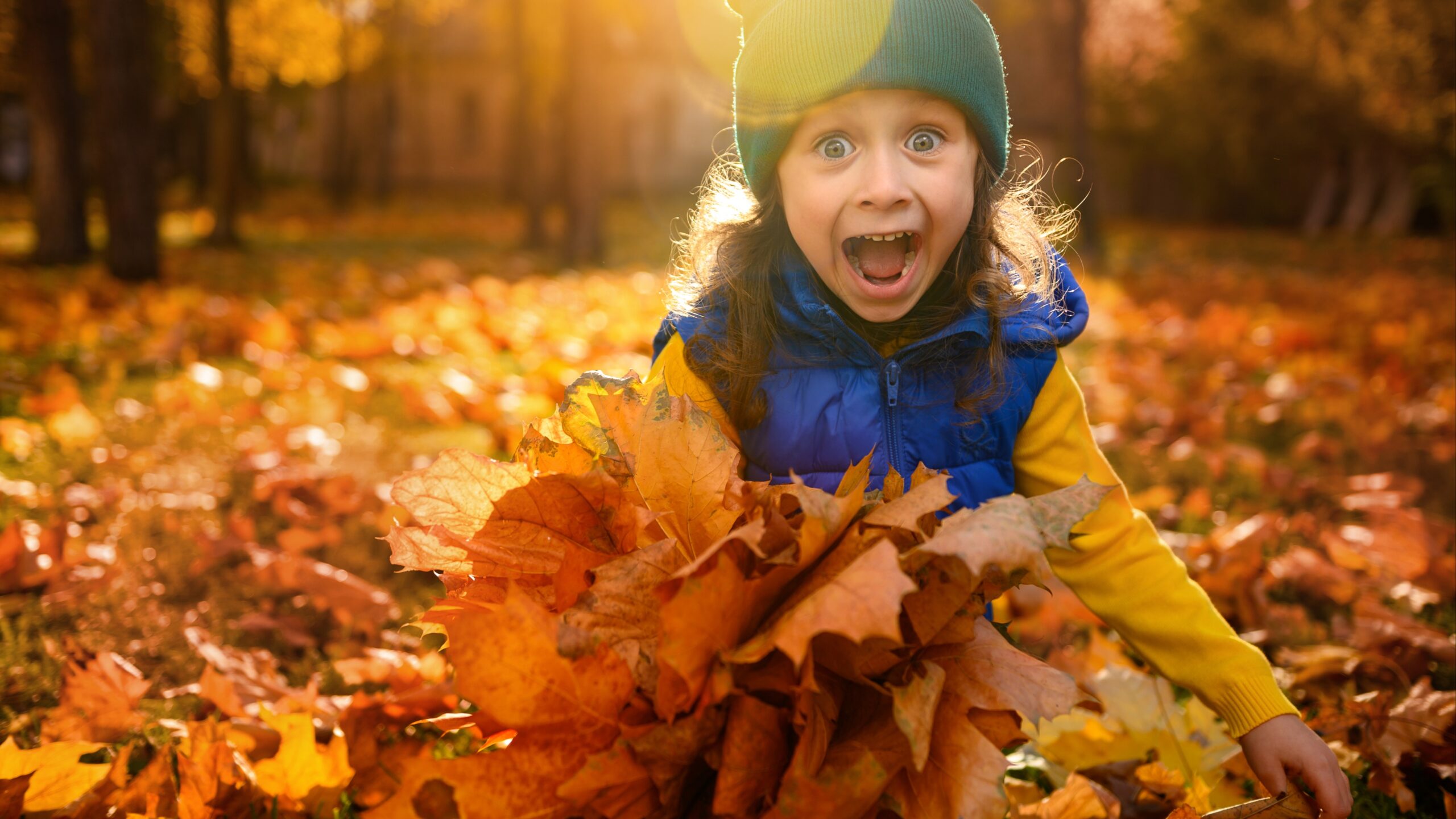 girl in the fall leaves
