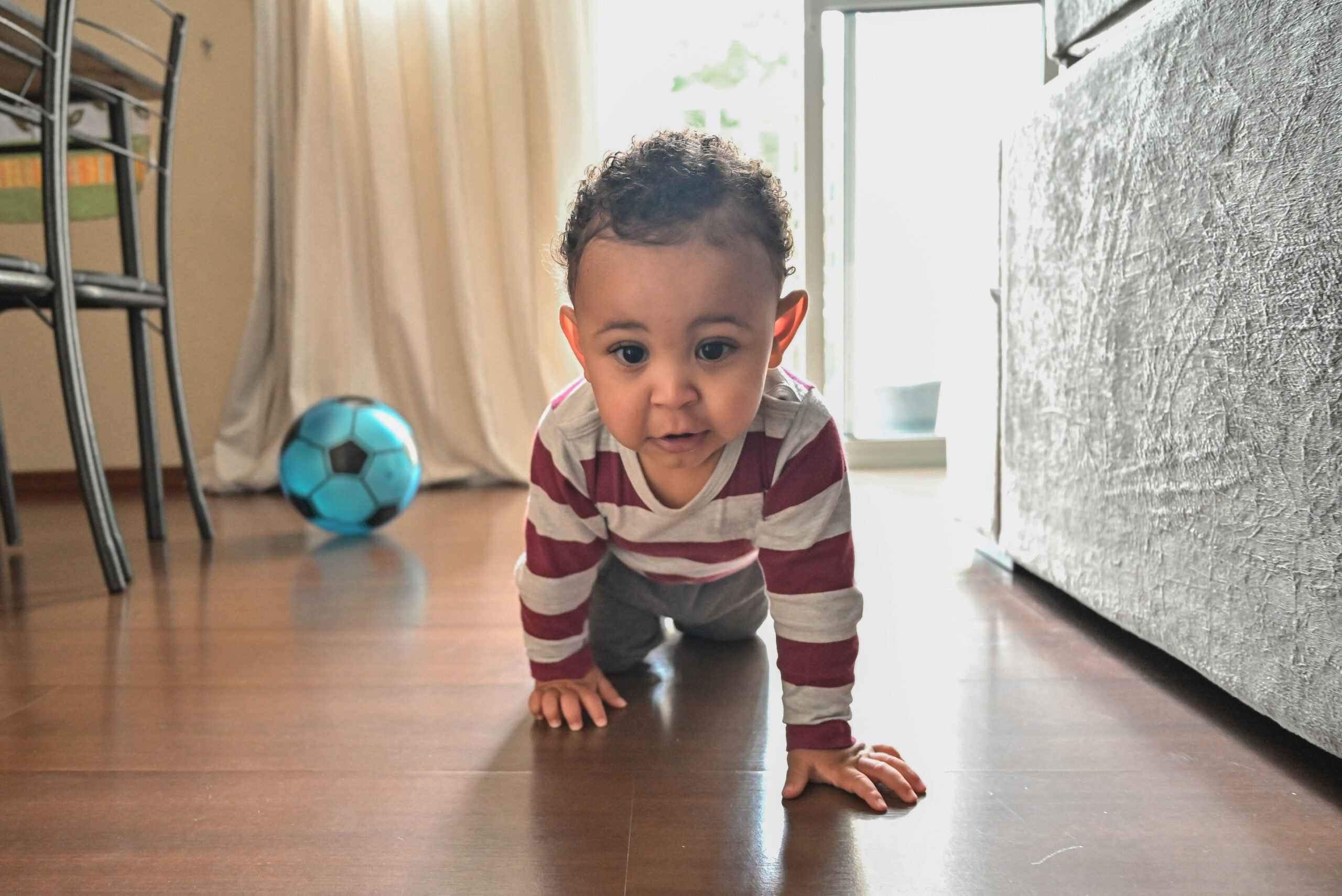 Happy baby crawling on the floor