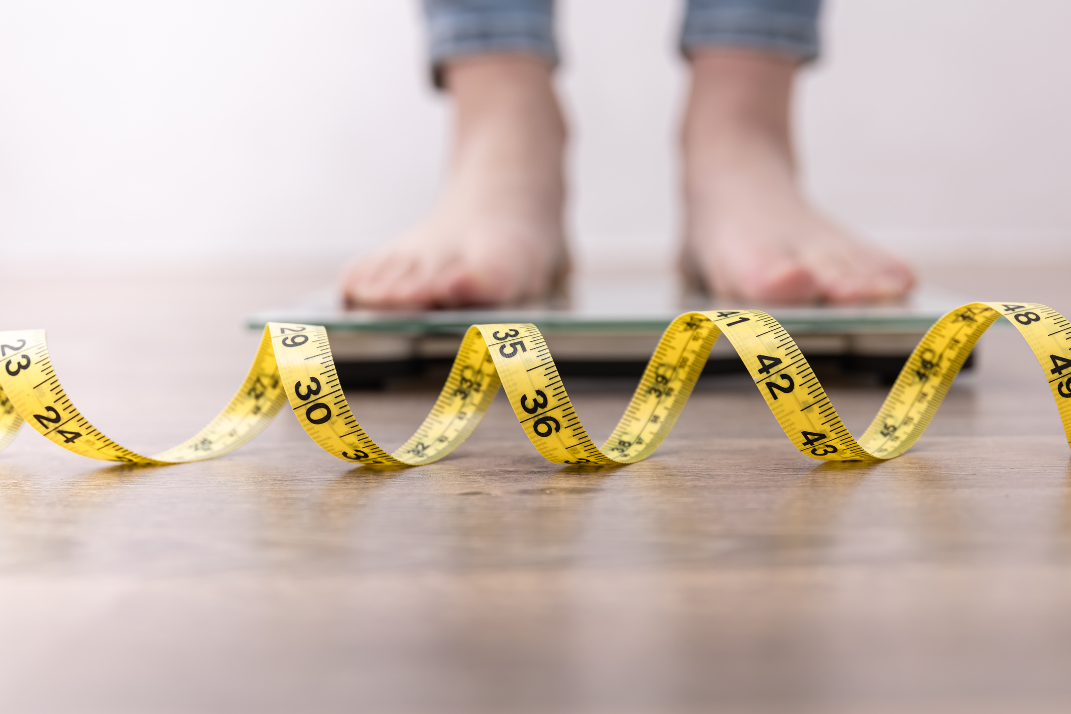 A person stepping on a scale