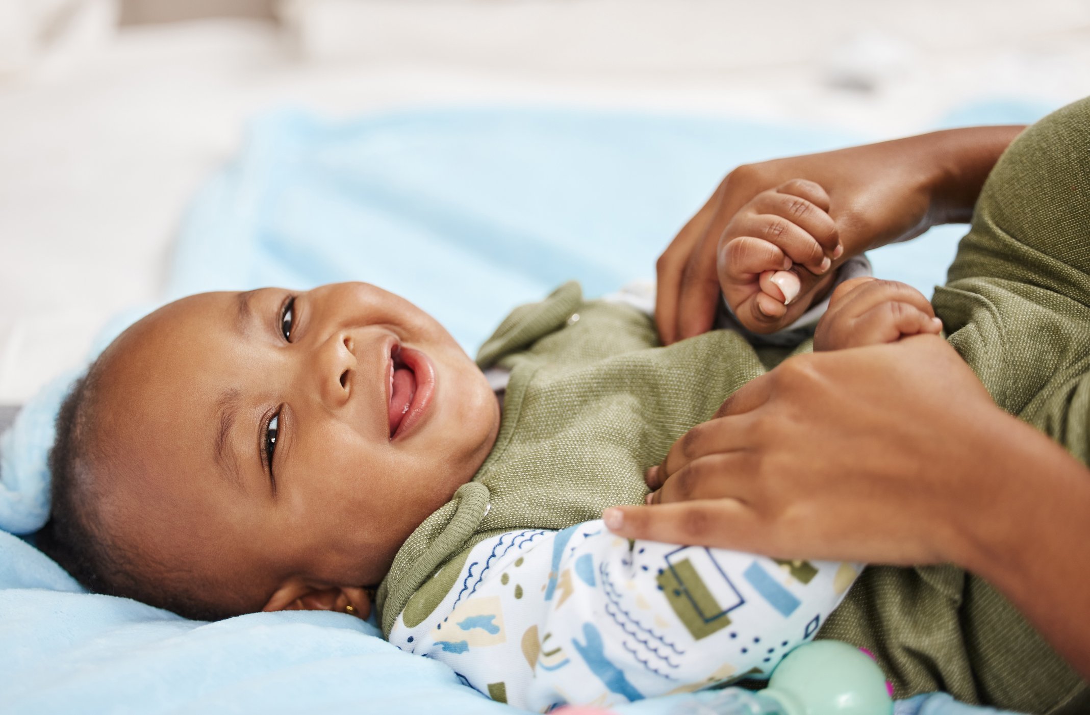 Shot of a woman bonding with her baby at home