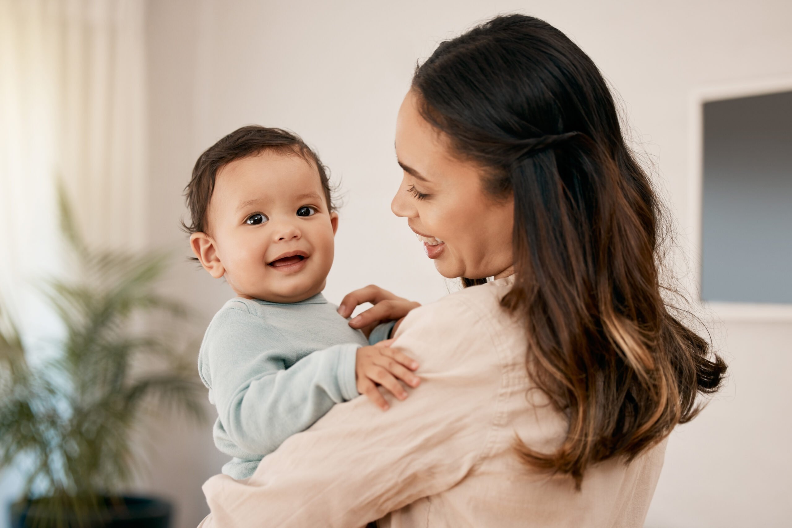 Shot of a young mother bonding with her adorable baby at home