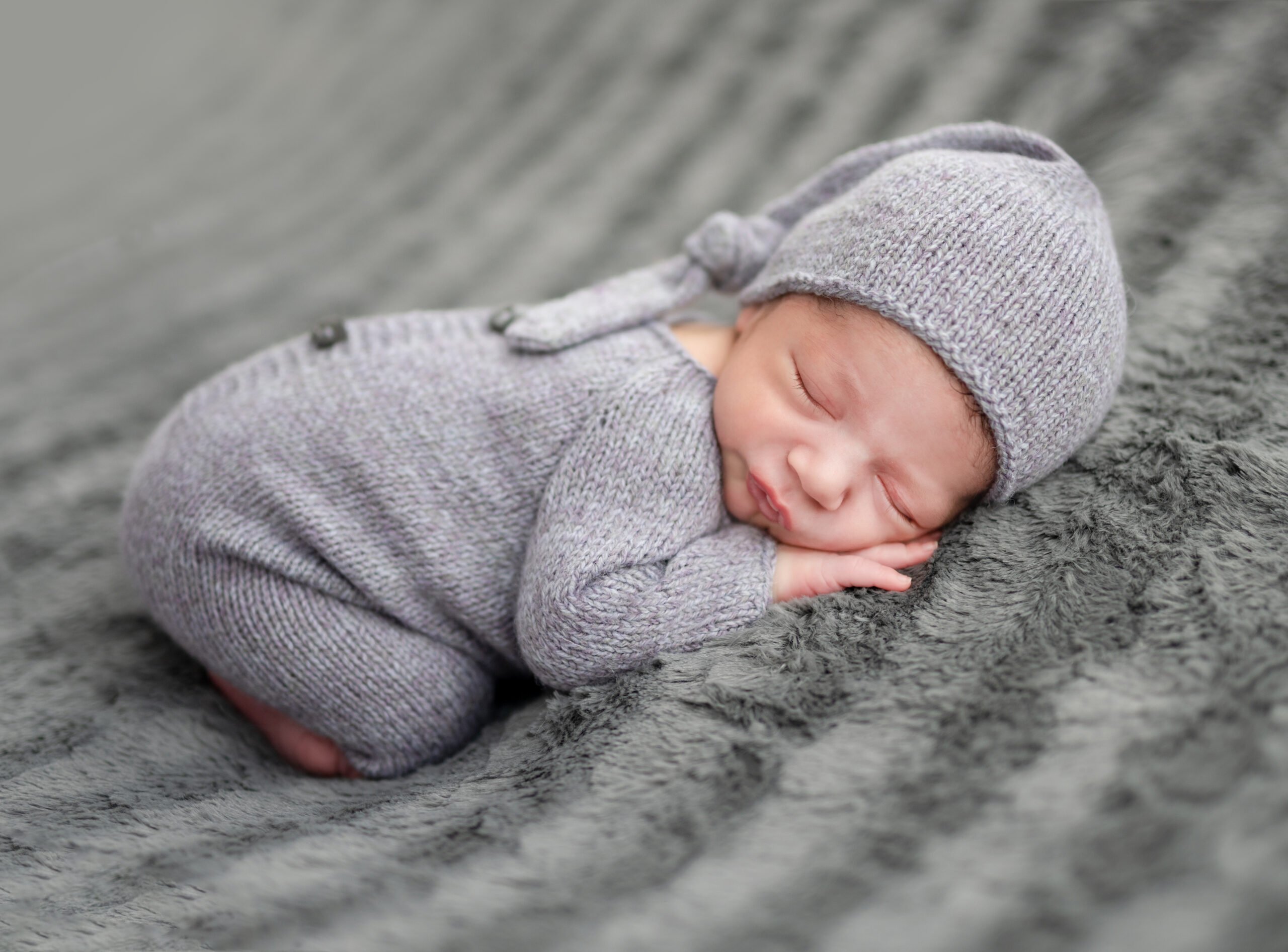 Newborn in grey suit