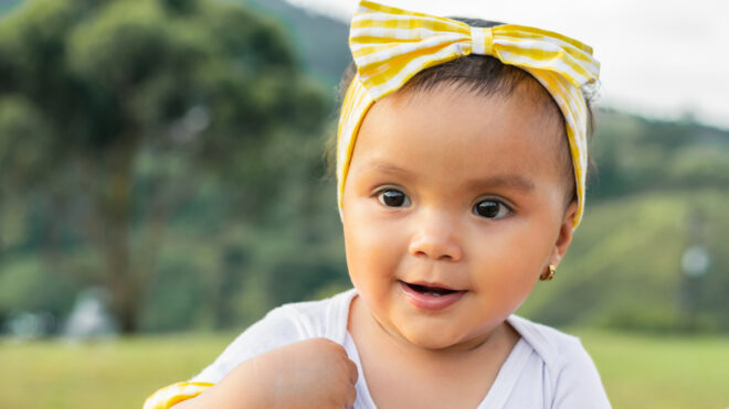 Baby in a yellow bow headband