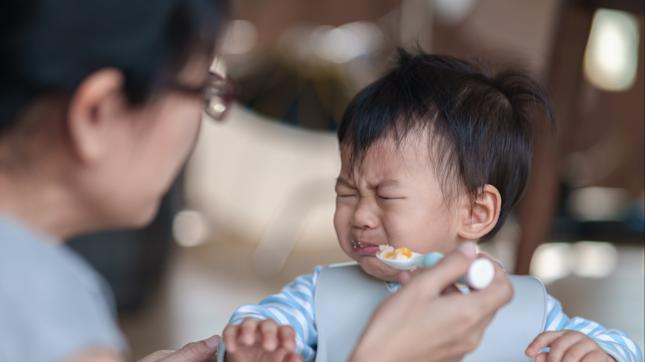 A baby refusing to eat