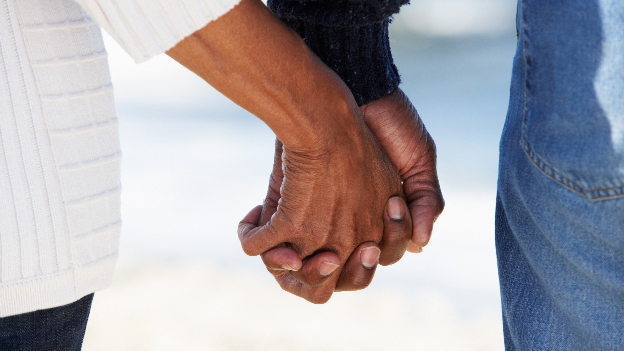 Couple holding hands