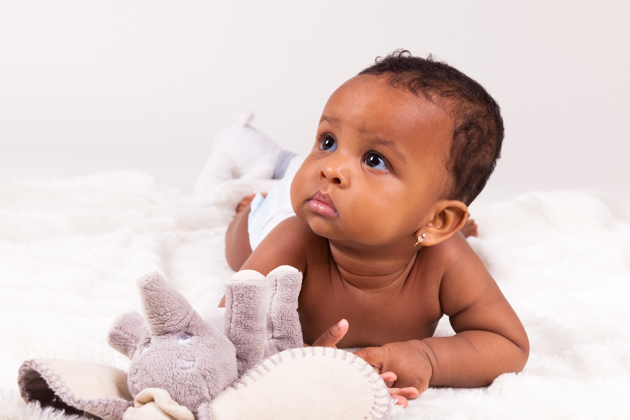 Adorable african american baby girl lying down