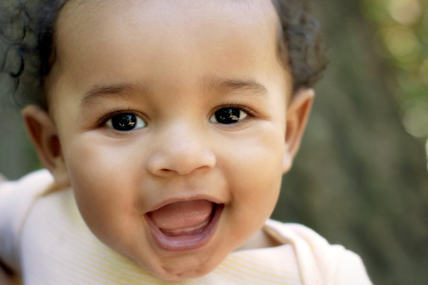 Close up cute African American baby outdoors