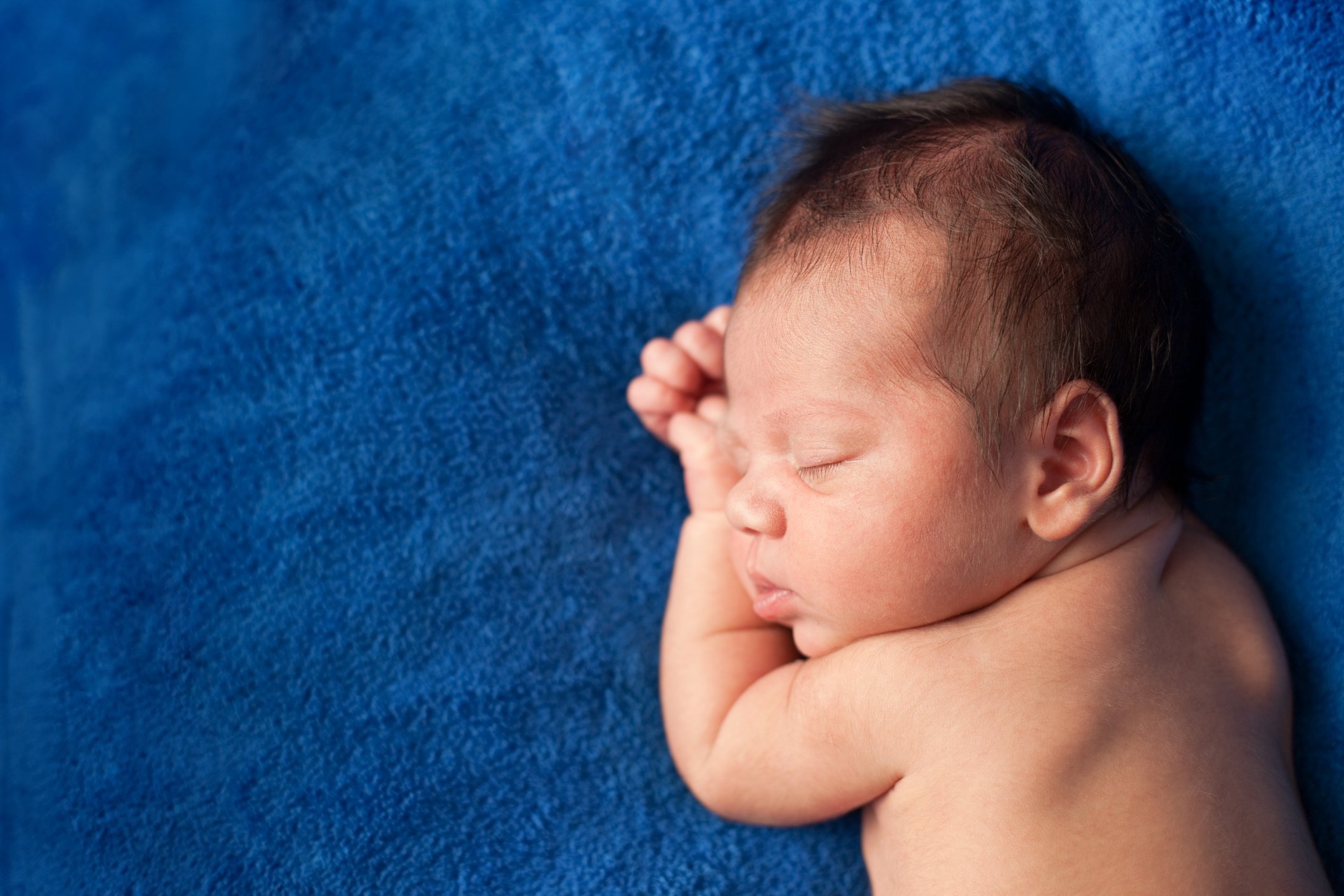 Color Image of Baby Boy Sleeping Peacefully, With Copy Space