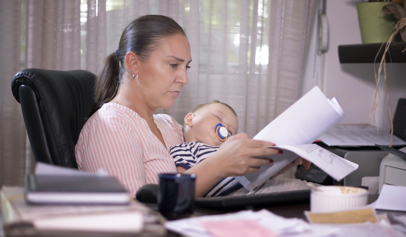Office businesswoman and her baby