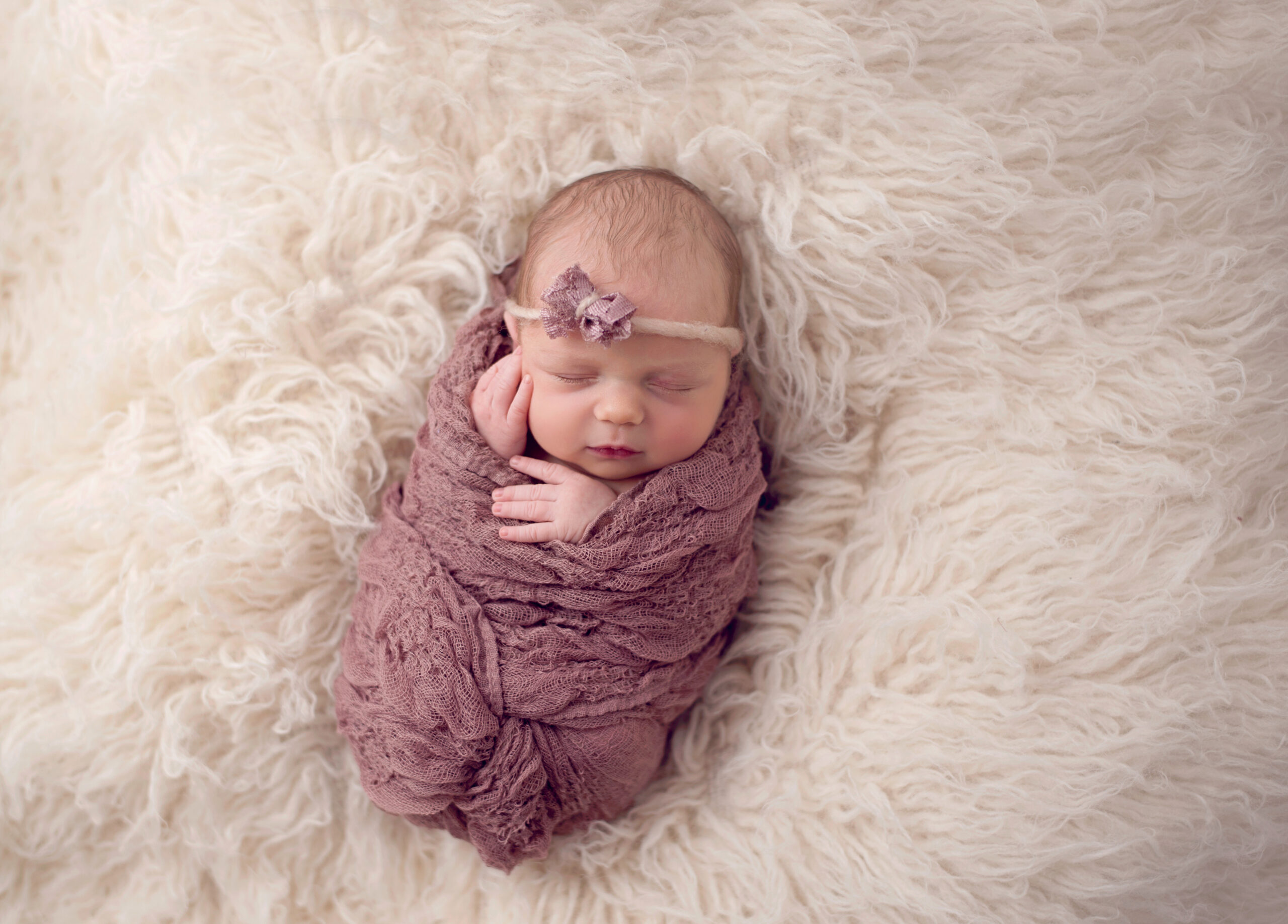 Newborn Girl Swaddled on Fur