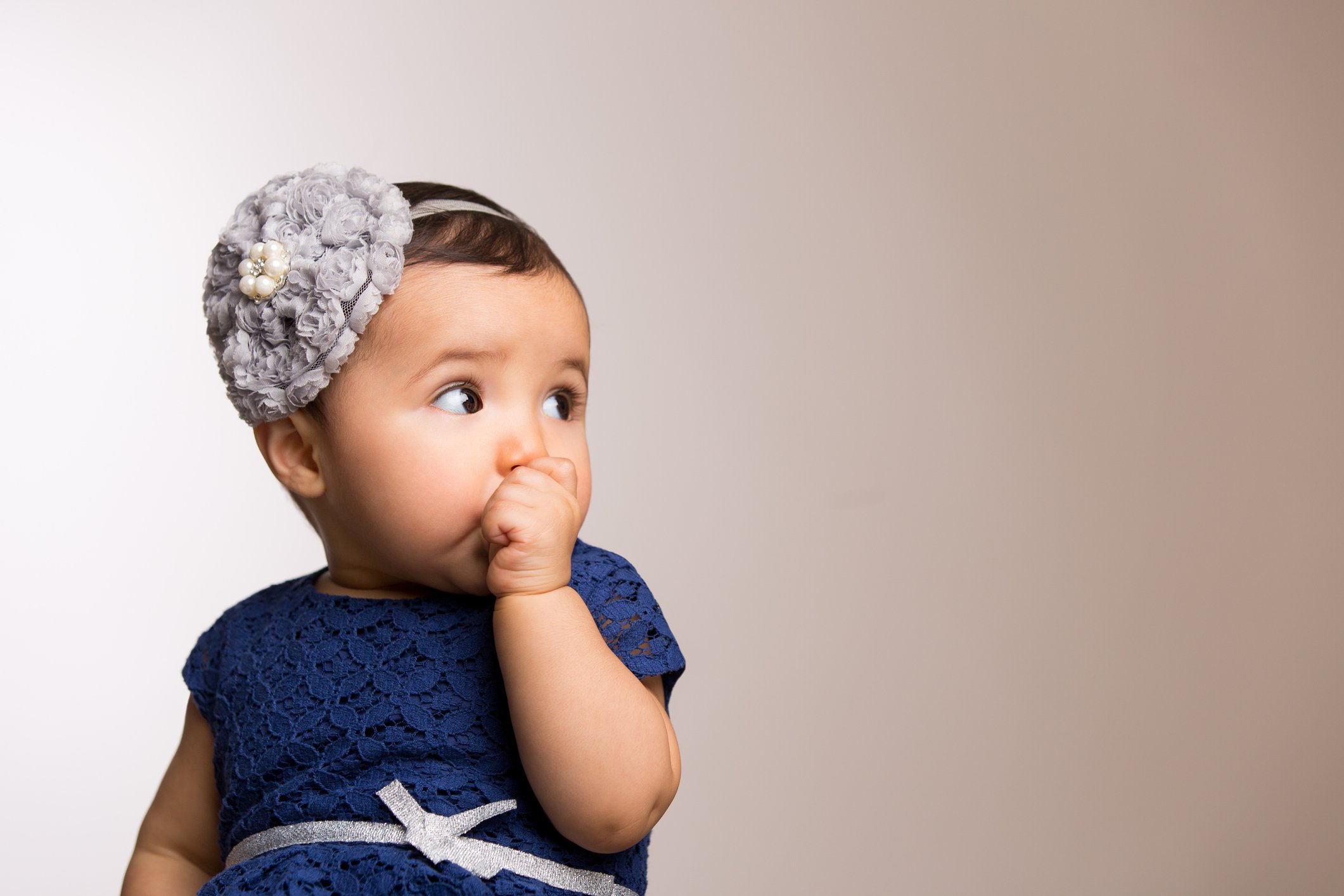 Baby girl sucking thumb