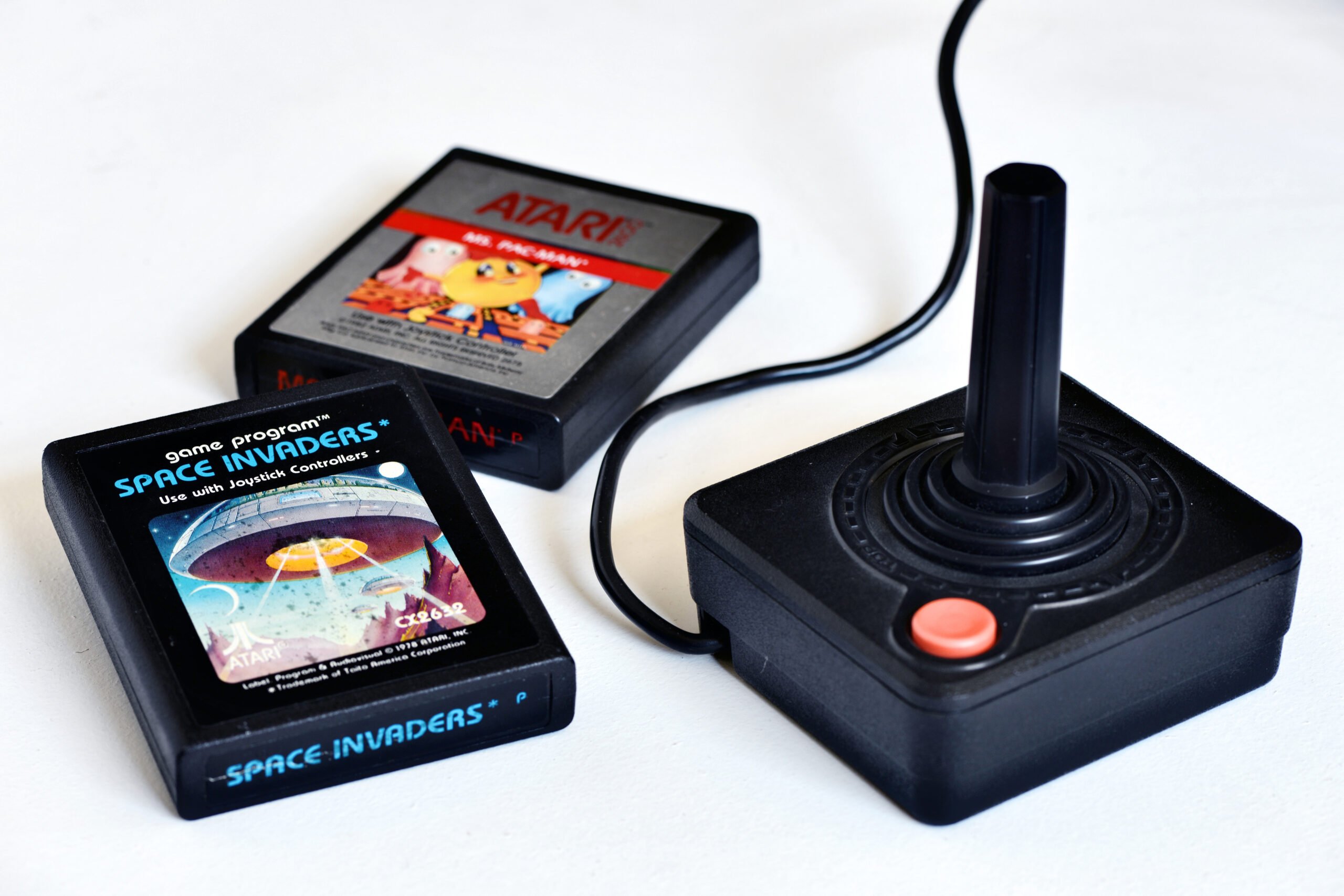 Vintage Atari 2600 video game cartridges with joystick