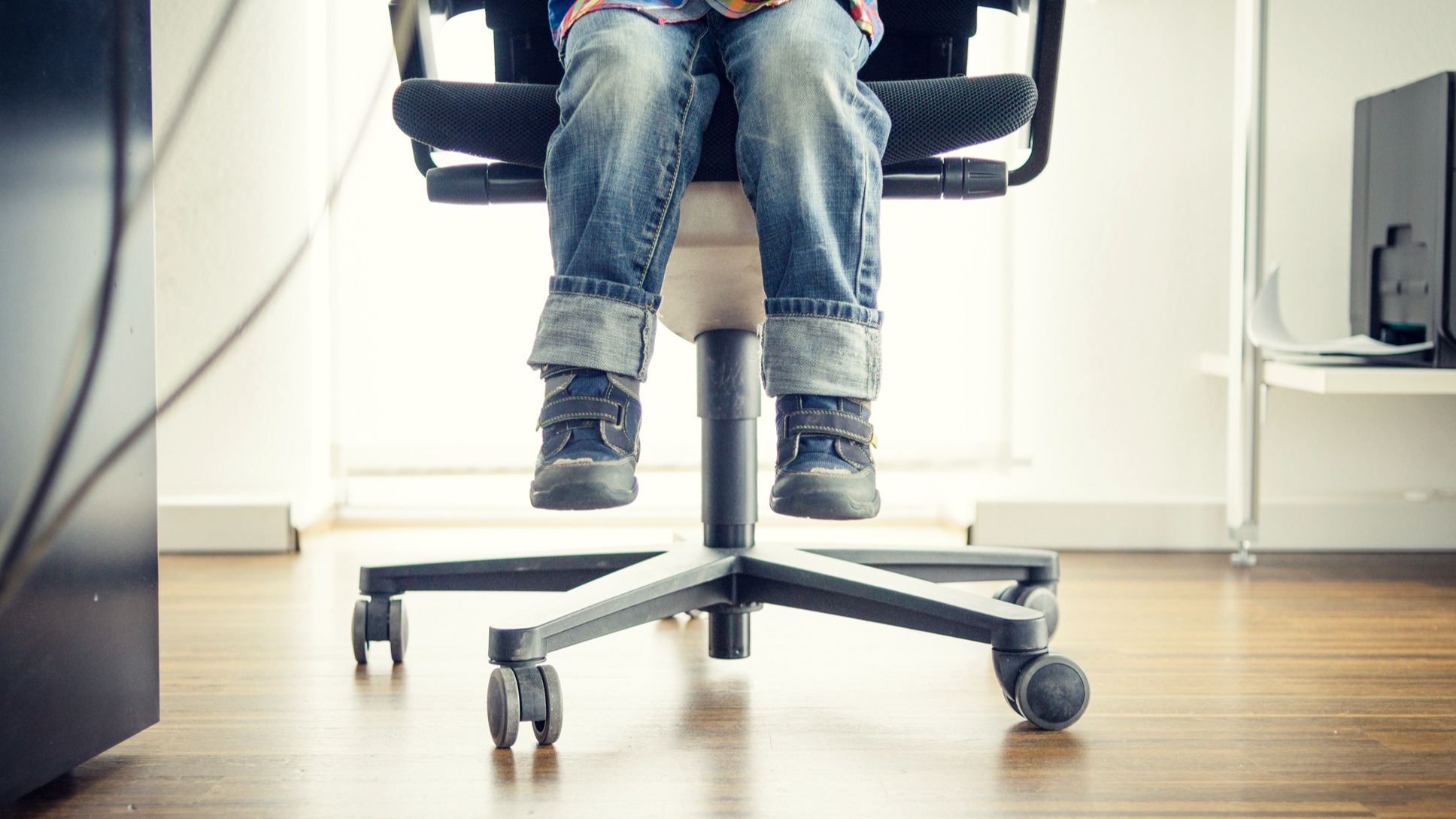 Little kid sitting at a desk