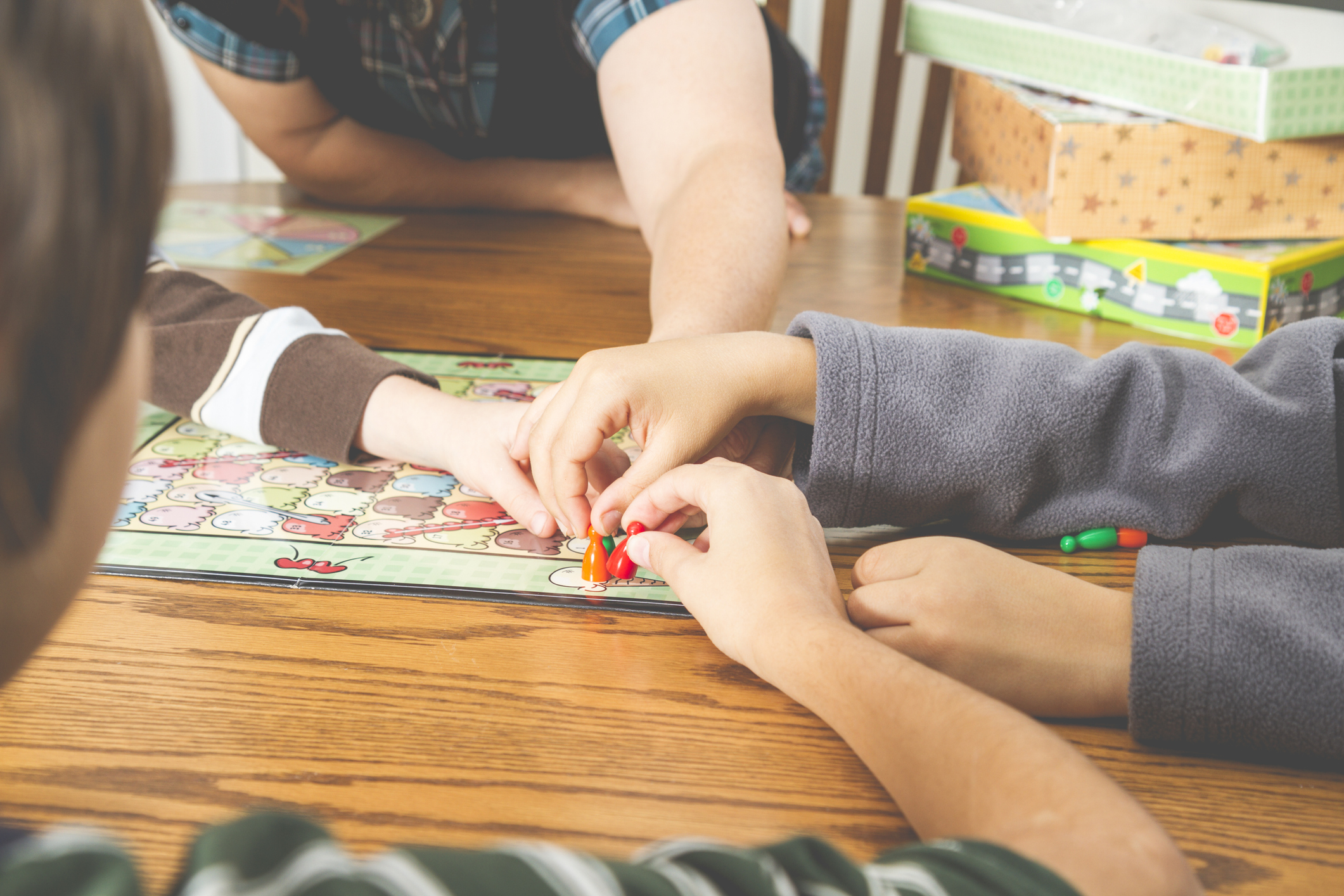 Family Playing A Board Game Together