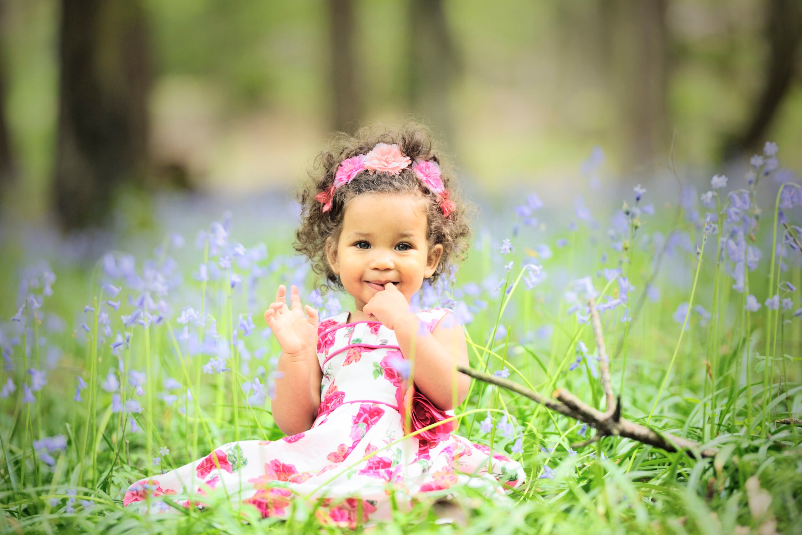 Beautiful Baby Girl Surrounded By Bluebells