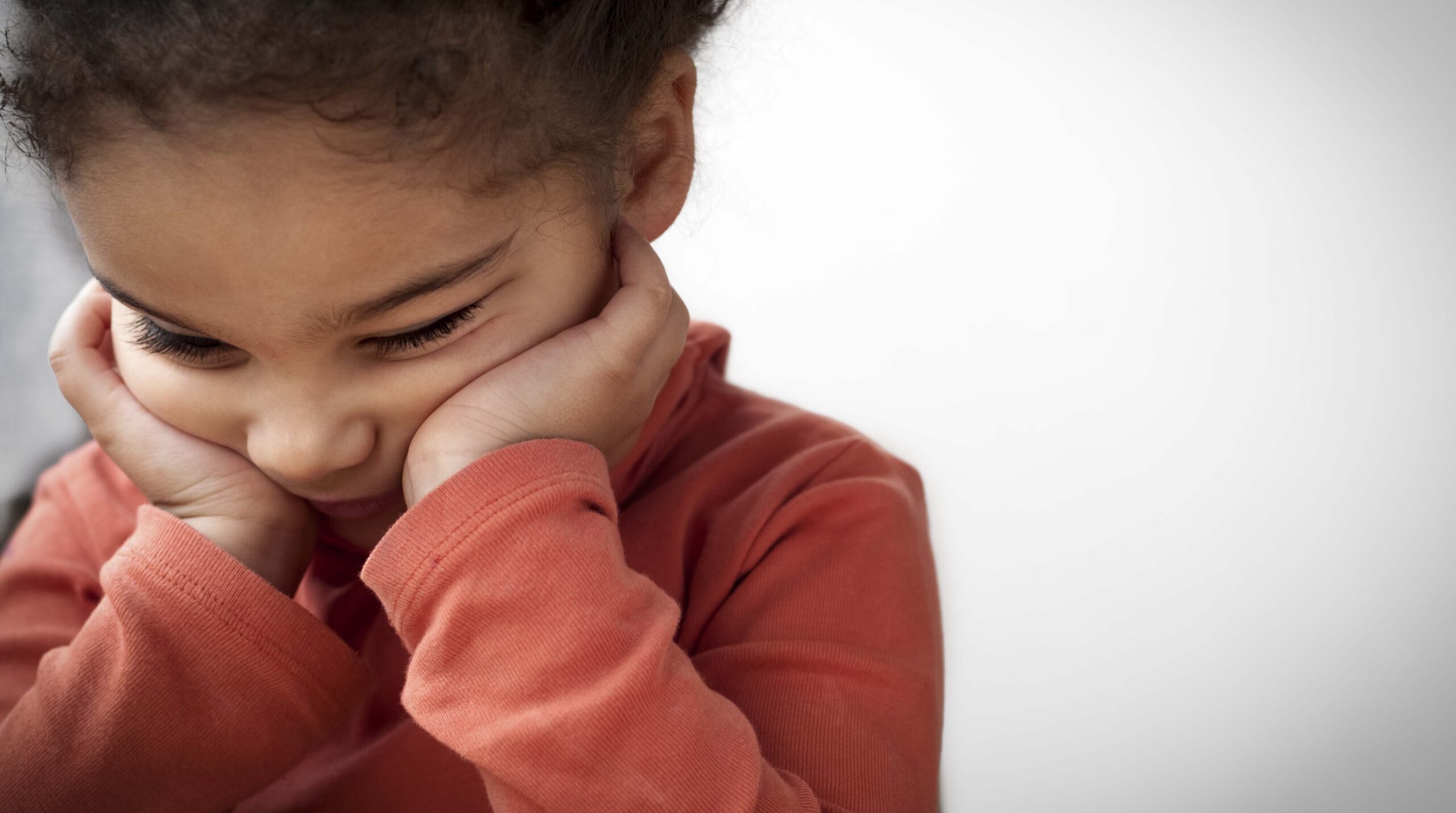Unhappy Child (4-5)  With Her Head in Hands