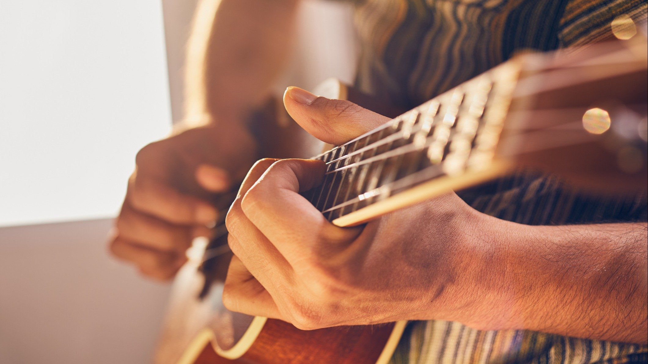 A man playing the guitar