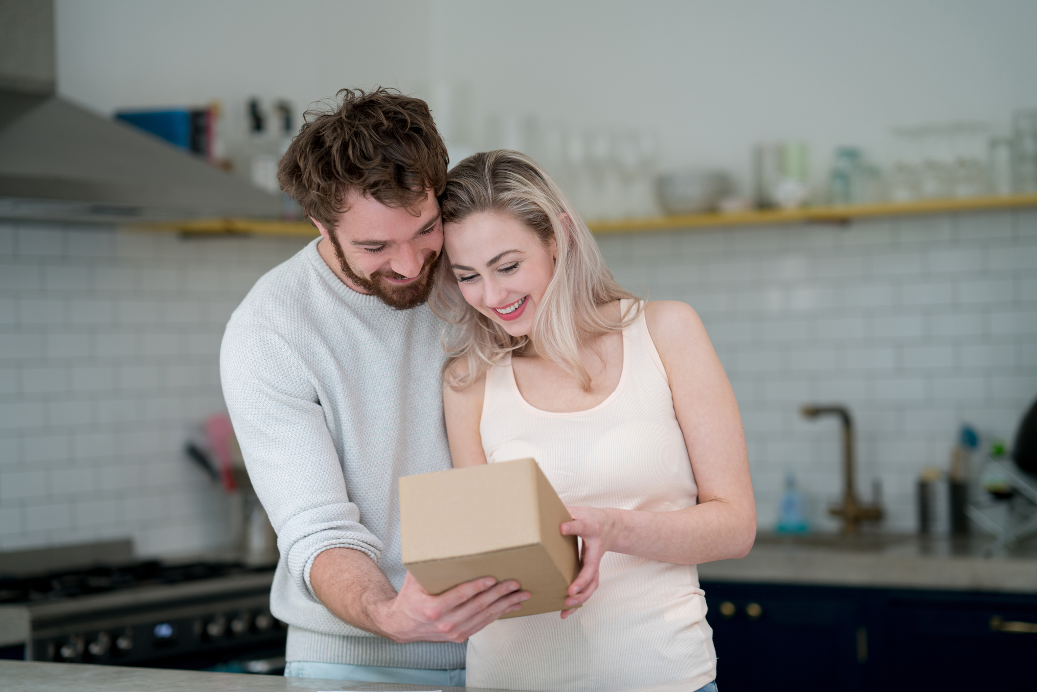 Couple getting a package on the mail