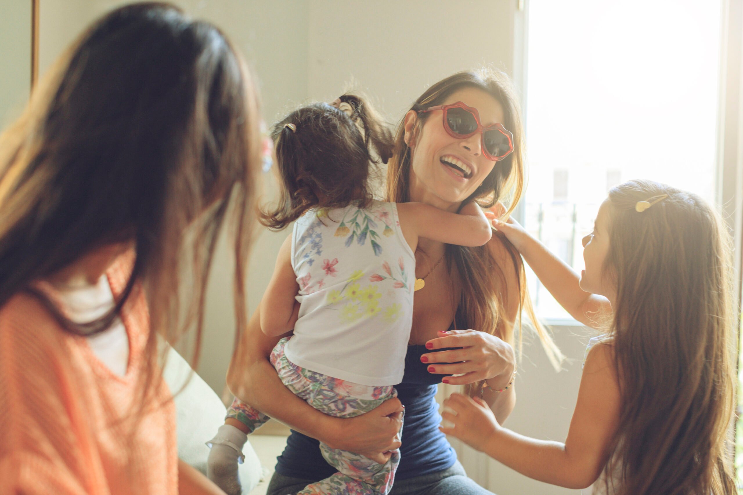 Mothers and daughters having fun together at home