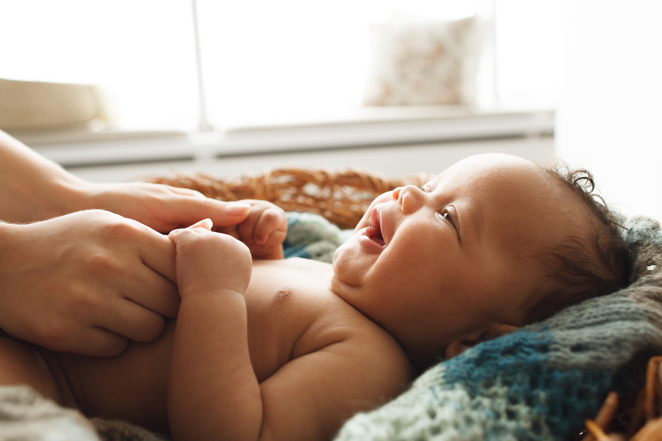 Baby smiling at mother, close-up