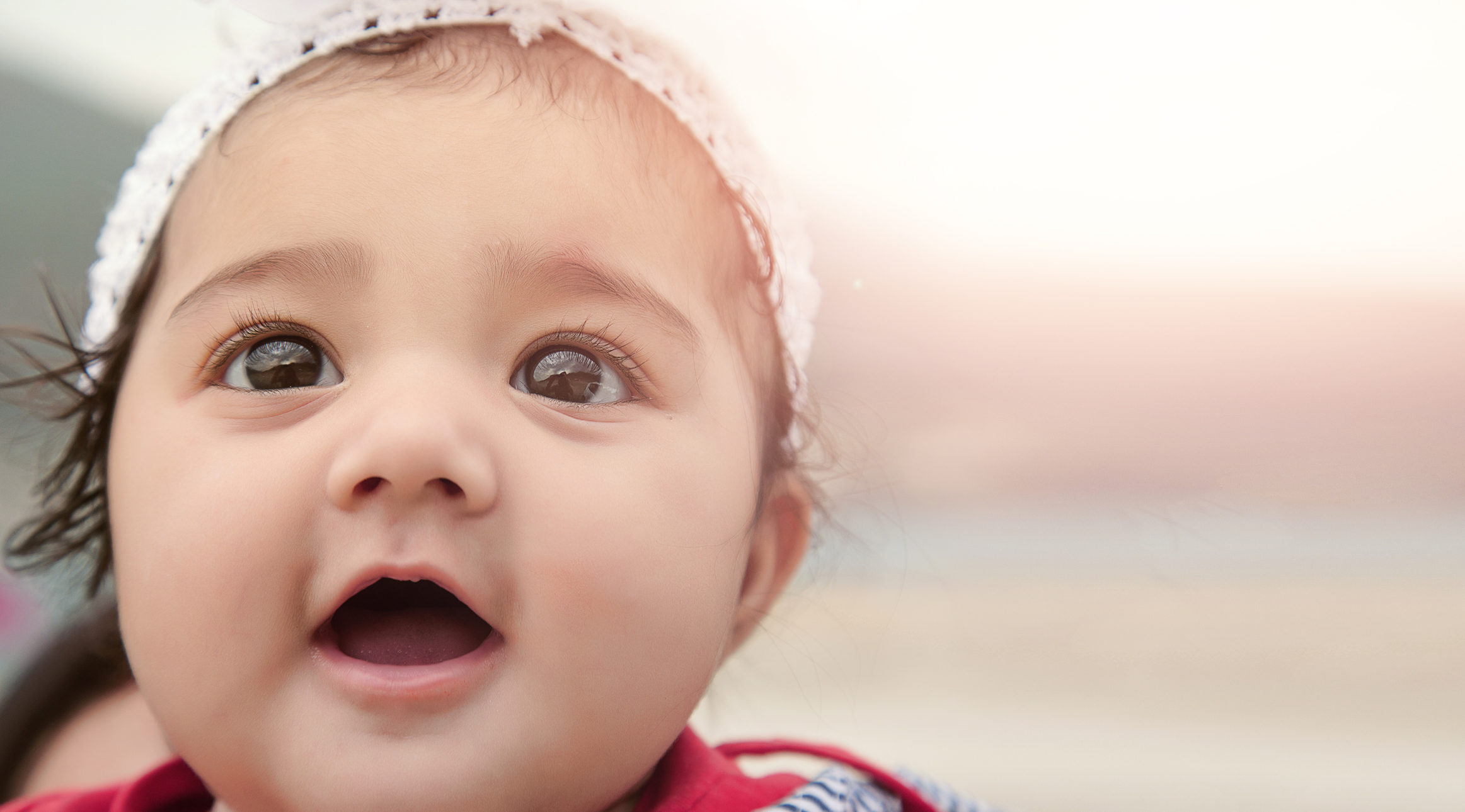 Happy Baby Girl with Background for Copy-Space.