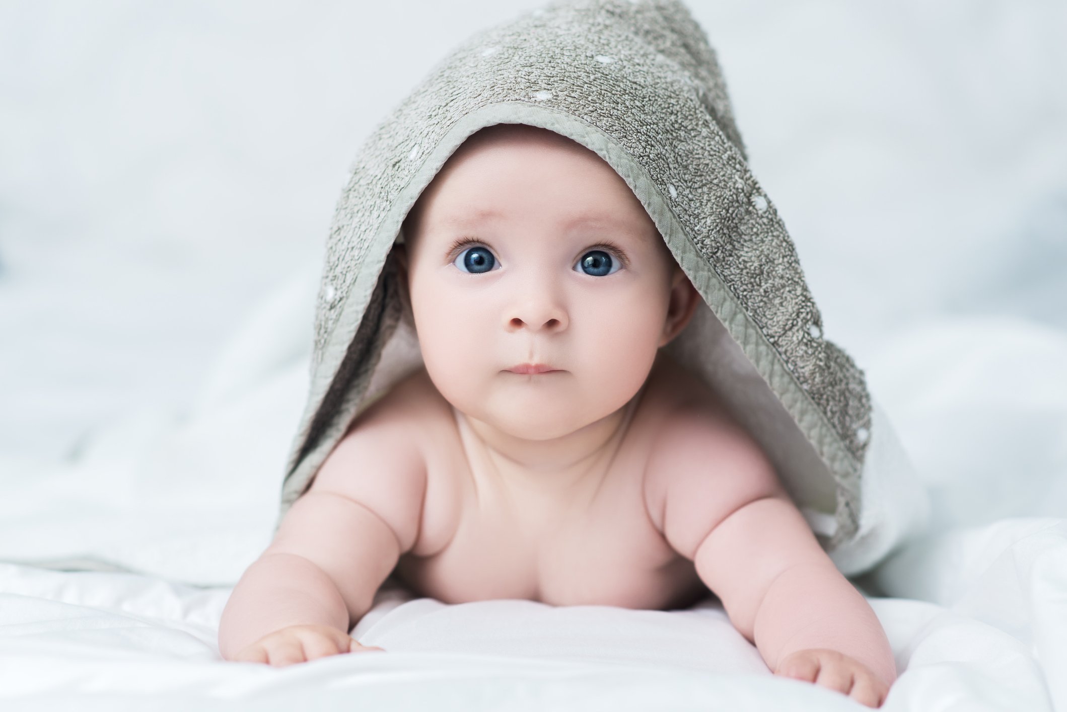 Baby girl or boy after shower with towel on head