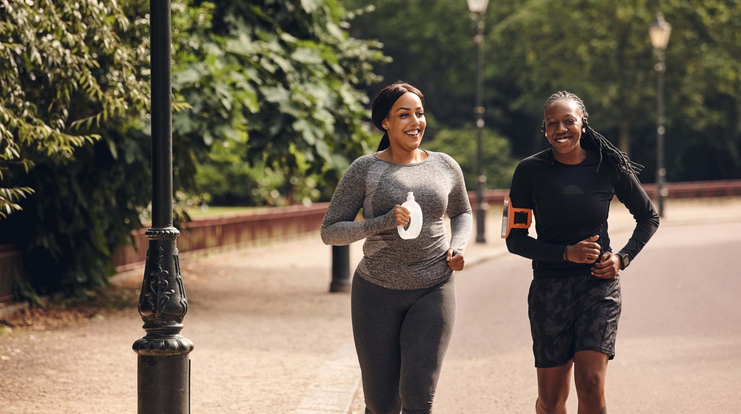 Female friends running in the park