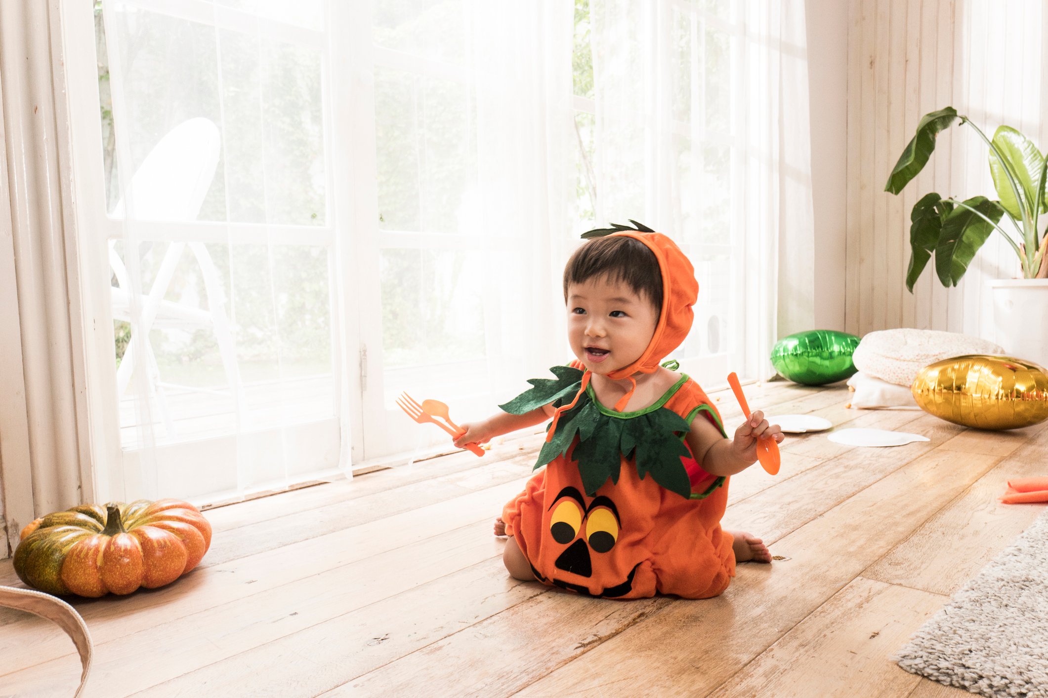 A portrait photo of a cute boy wearing a costume.
