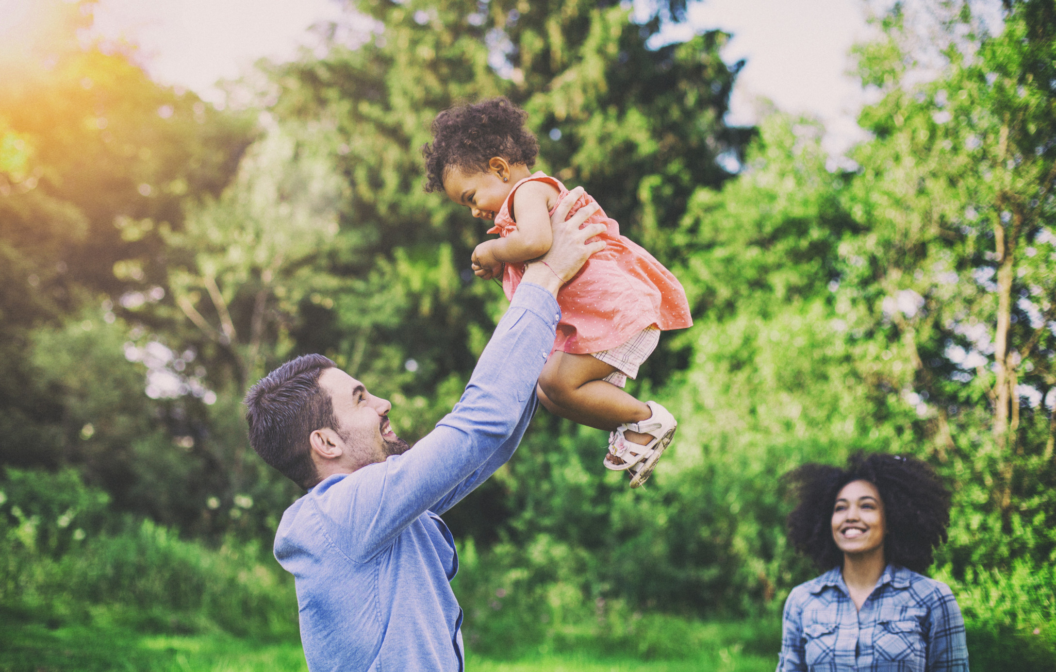 father playing with baby