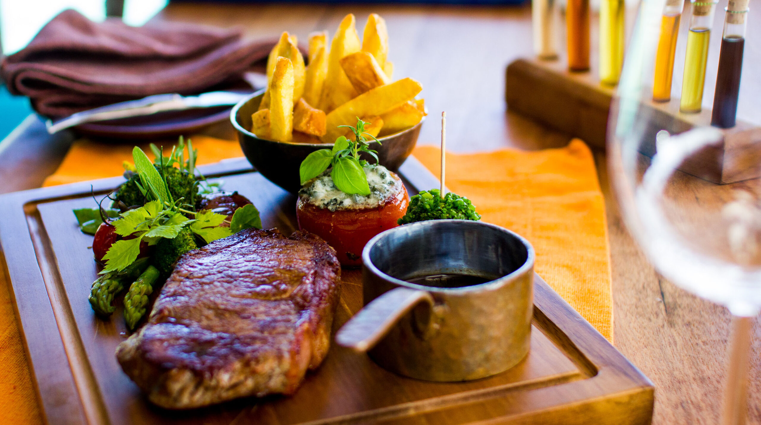 Steak and Fries on wood plate
