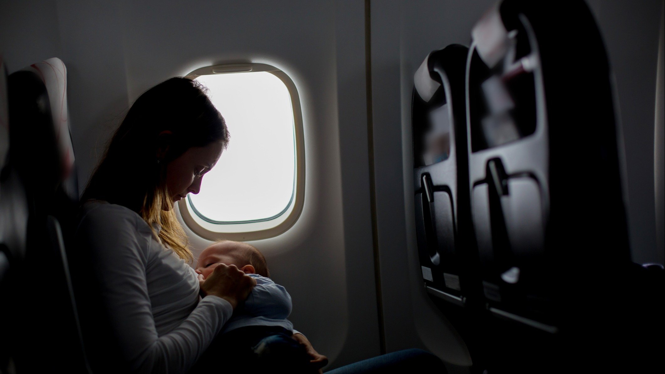Mom nursing on a plane