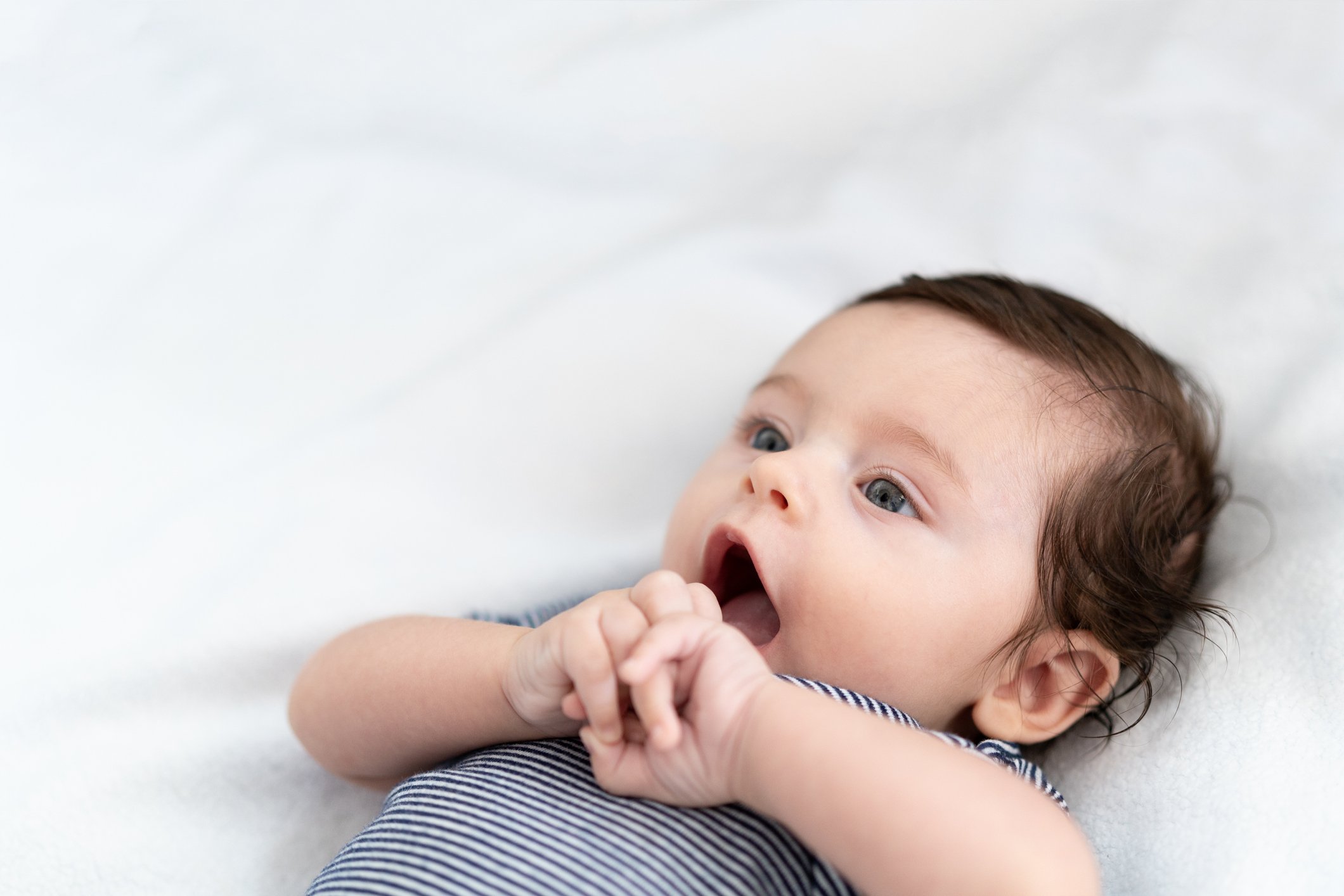 Baby lying on the bed