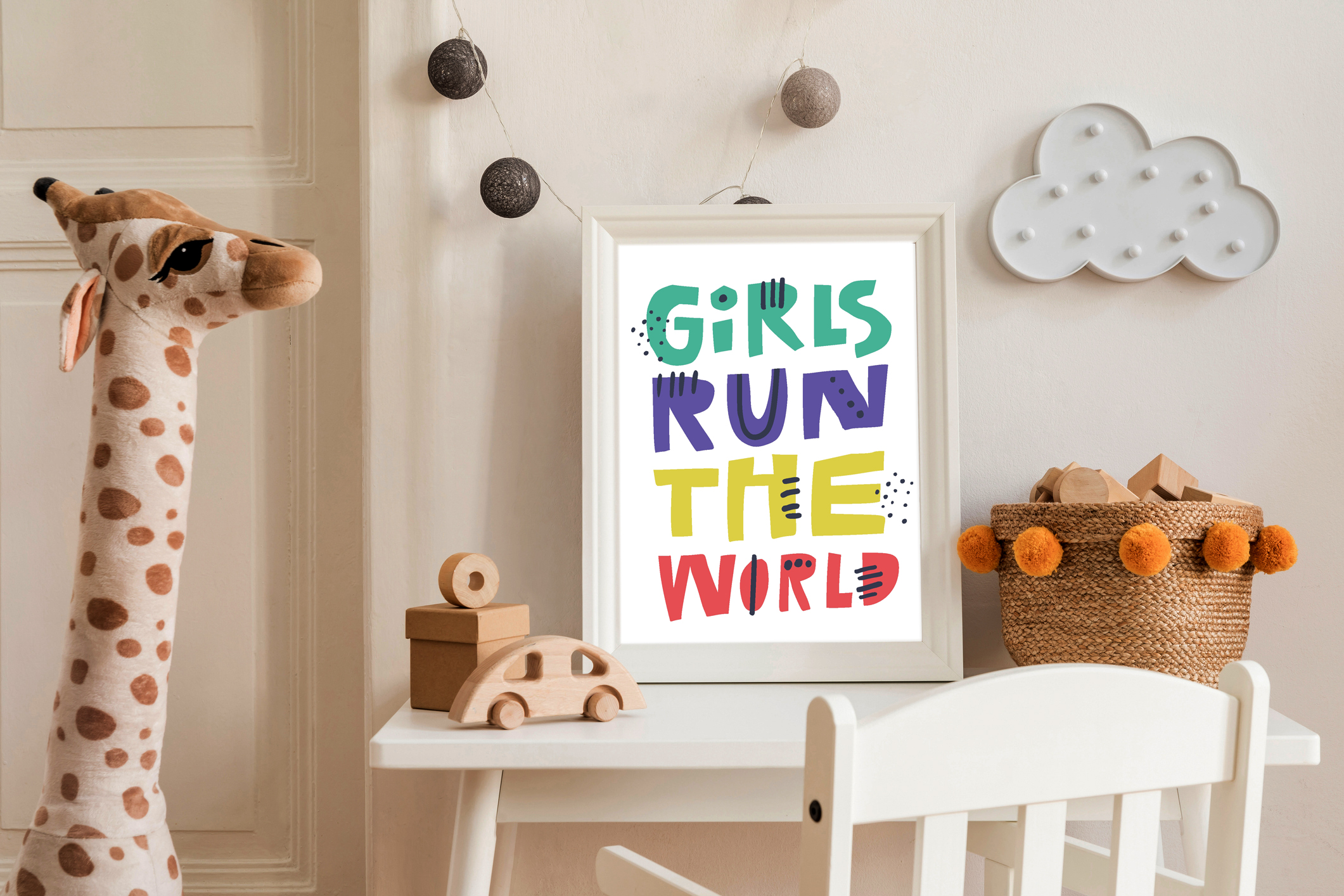 Modern and design scandinavian interior of kidroom with white desk, armachirs, mock up poster frame, natural basket, teddy bear, plush toys and cute children's accessories.