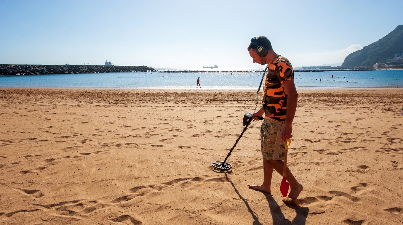Metal detector on beach