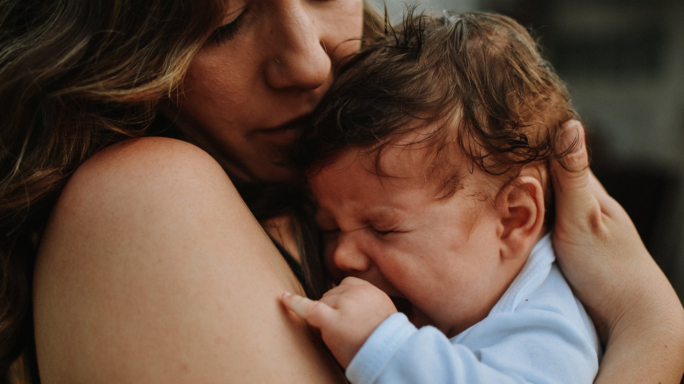 mom-holding-crying-baby