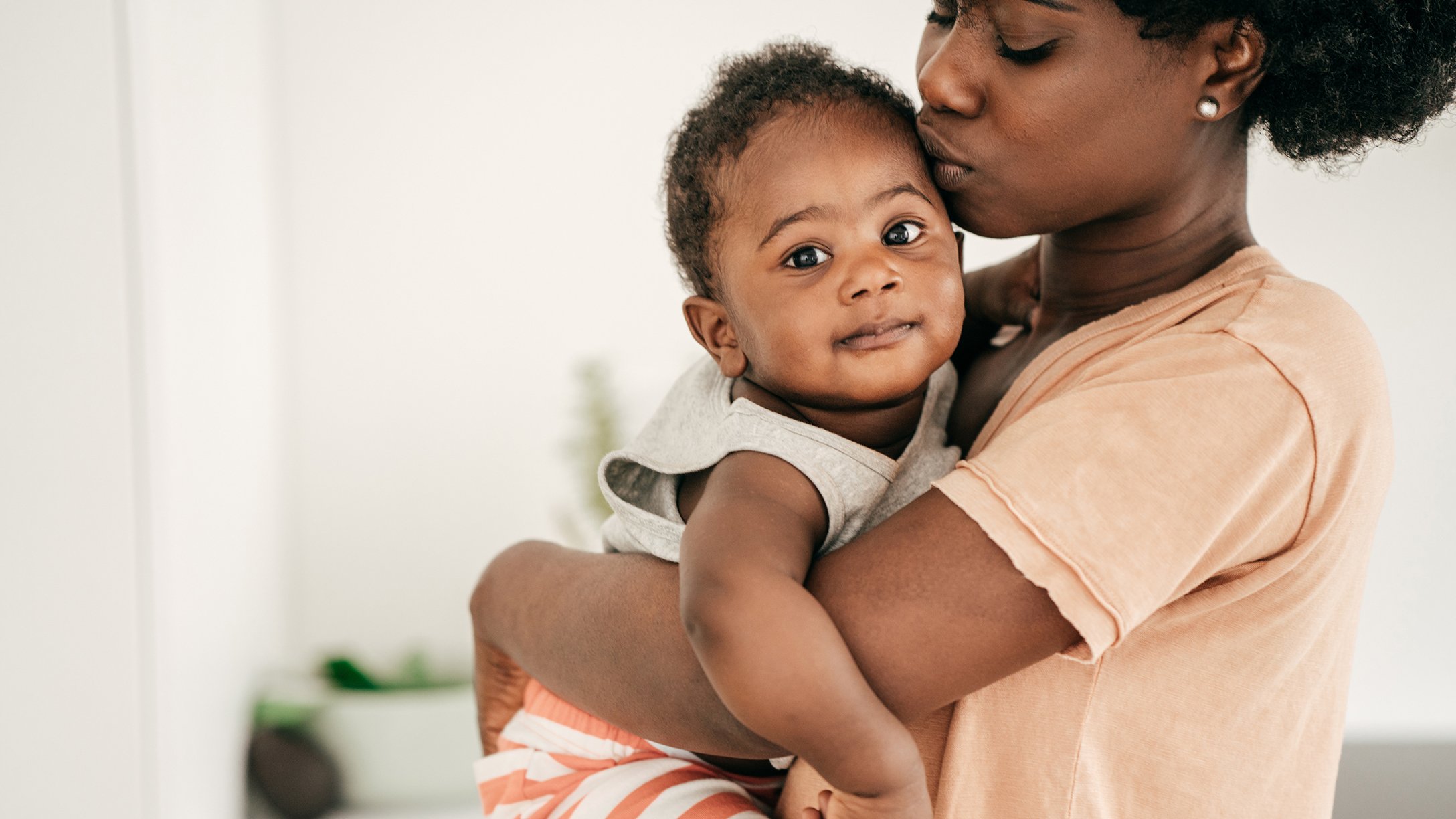 mom-kissing-baby