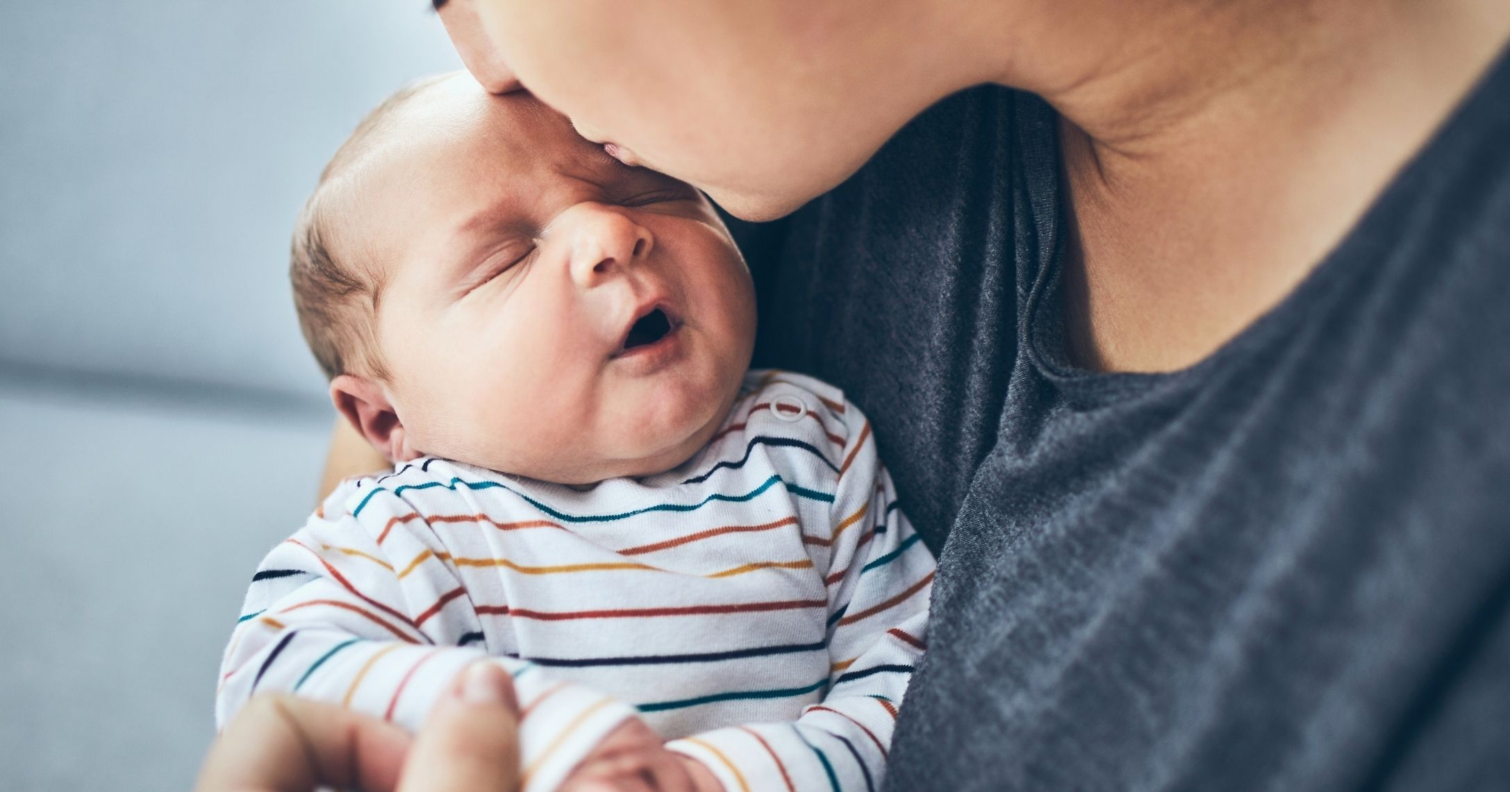 mom kissing son