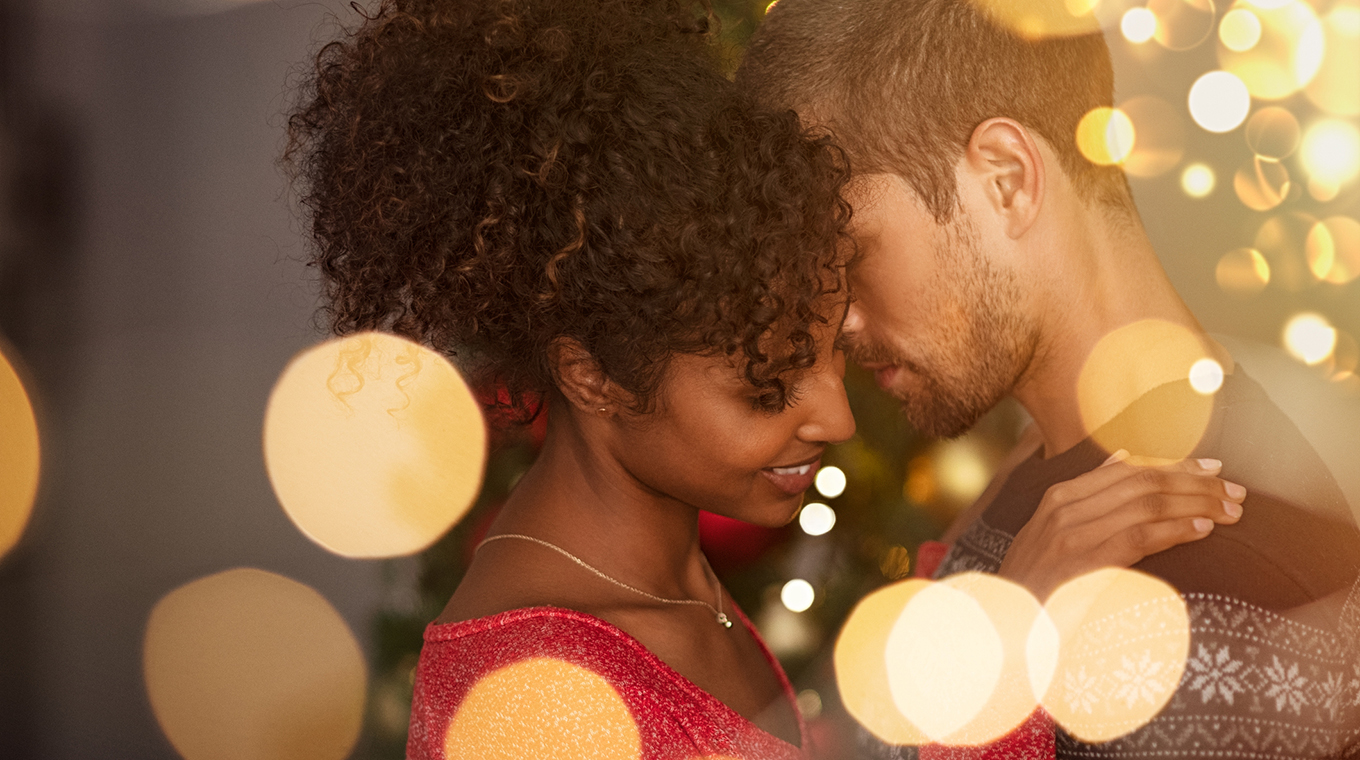 Loving couple embracing with warm lights