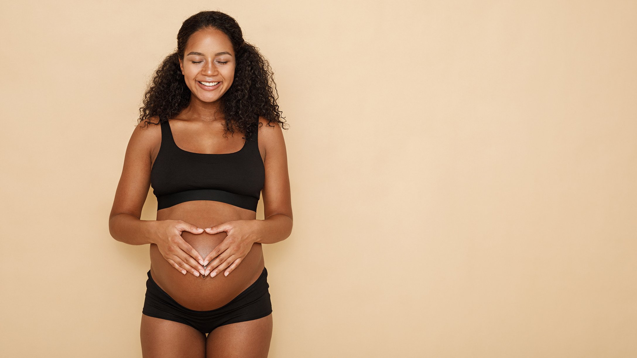 pregnant Black woman smiling