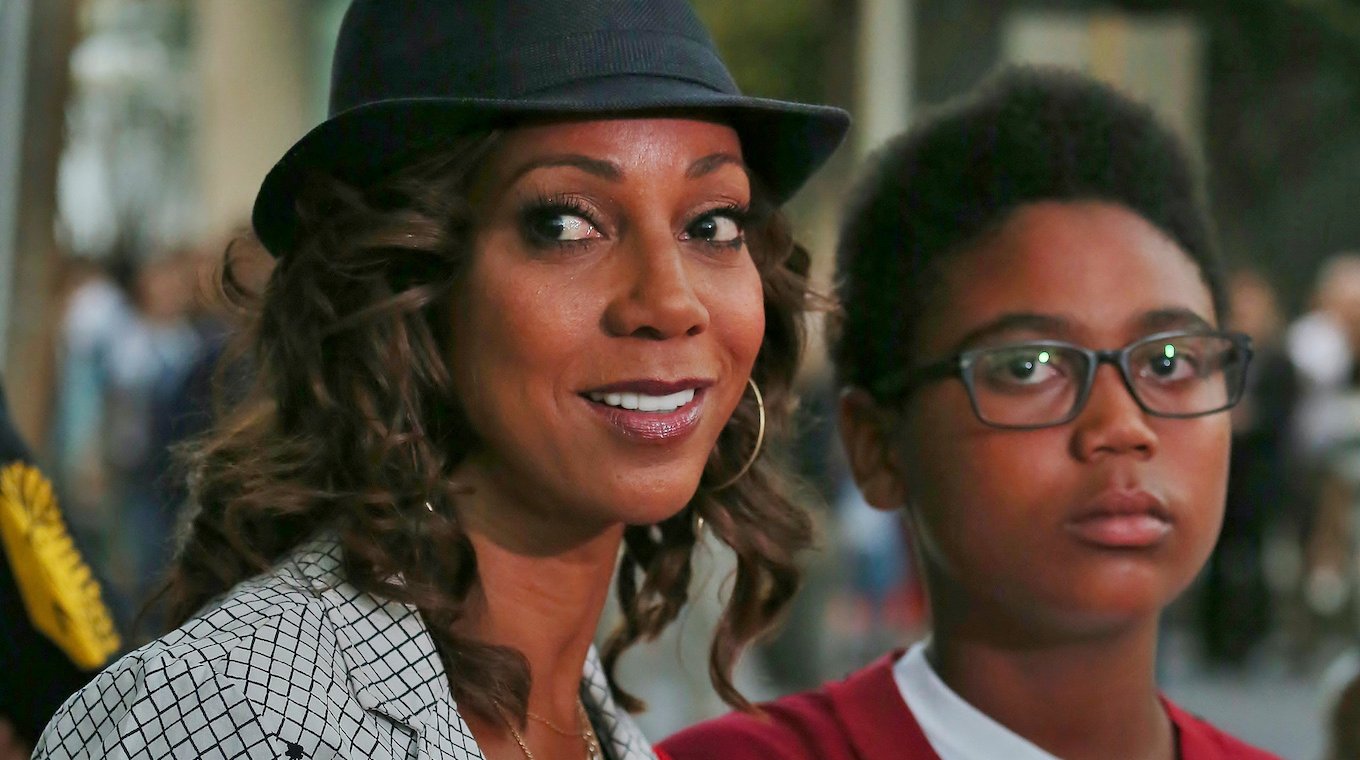 Holly Robinson Peete and her son RJ arrive at the LA Clippers game in Downtown LA in California