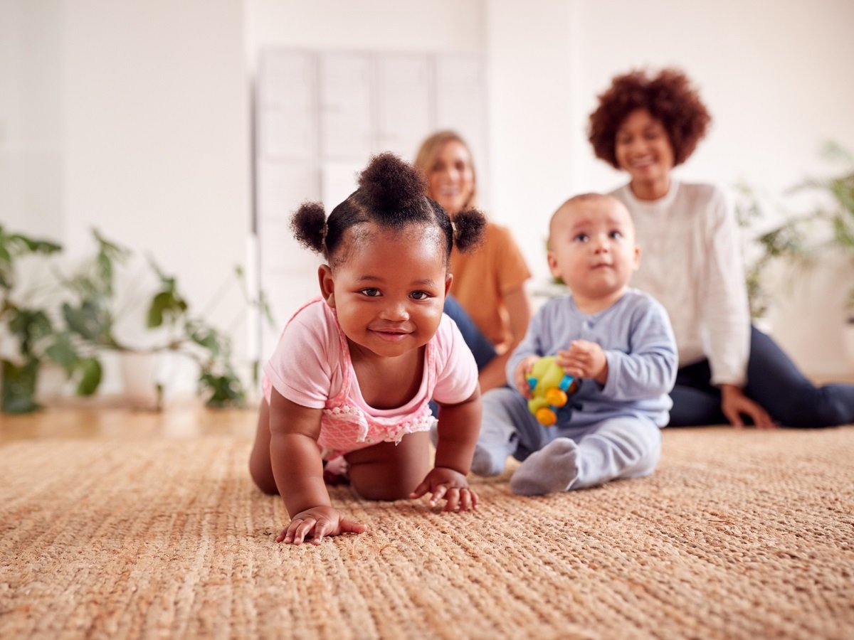 african-american baby and mom with caucasian baby and mom