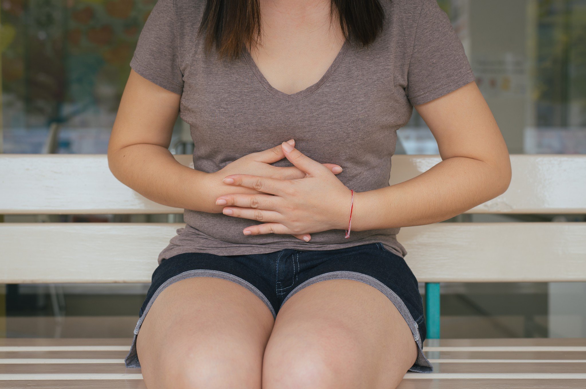 woman holding stomach