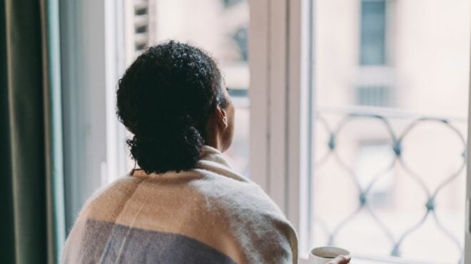 woman looking out the window