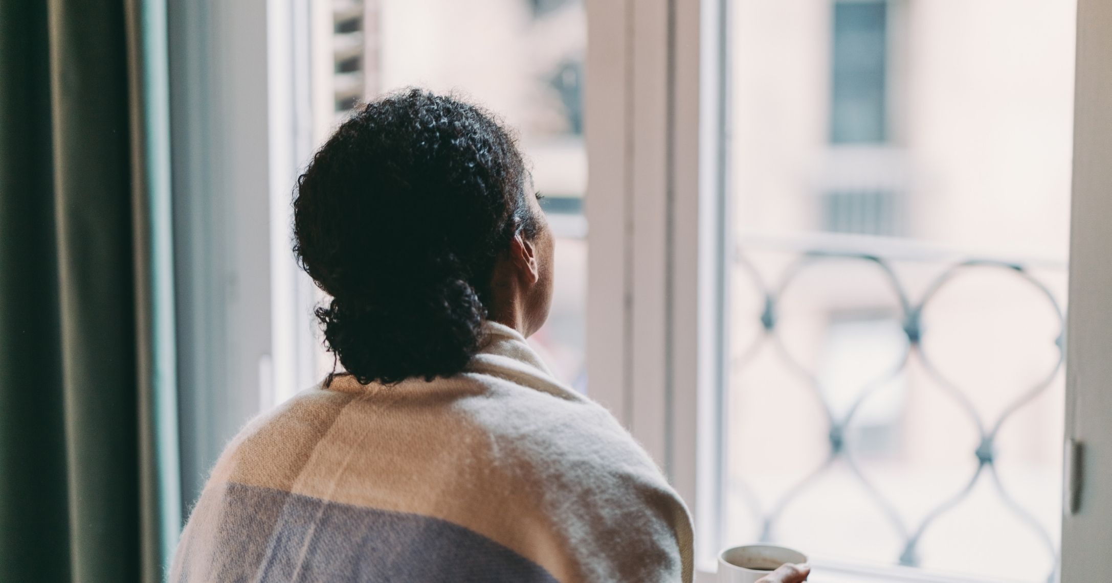 woman looking out the window