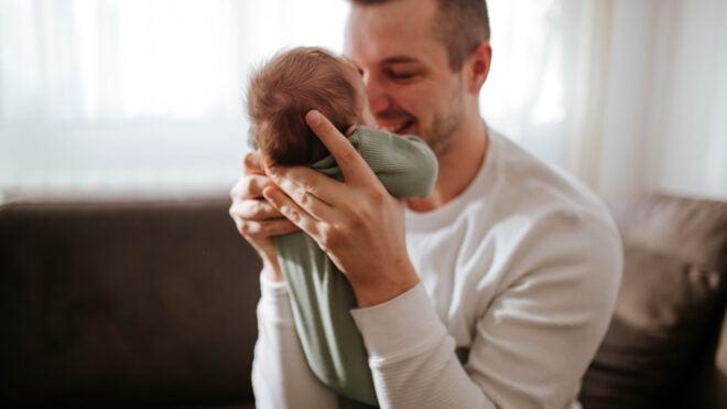 Young father holding his baby