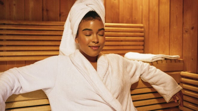 woman sitting peacefully with robe