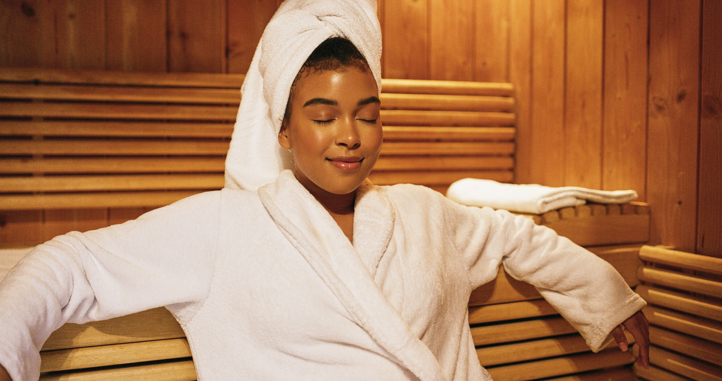 woman sitting peacefully with robe