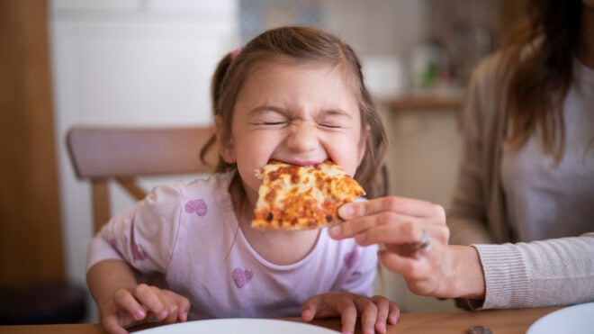 Cute Girl Eating Pizza