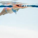 Pregnant Woman Swimming in Pool